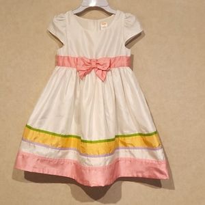 Cute! White special occasion dress with pink bow. Worn twice! Good condition.